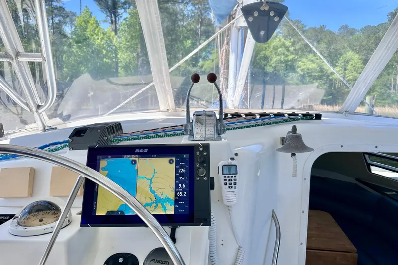 Slide: The Image of 1998 Manta 40 yacht cockpit with navigation equipment and steering wheel. - 88