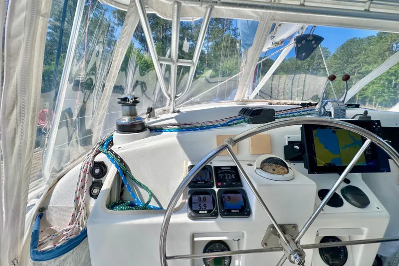 Slide: The Image of Cockpit of 1998 Manta 40 sailboat with navigation instruments and steering wheel. - 90
