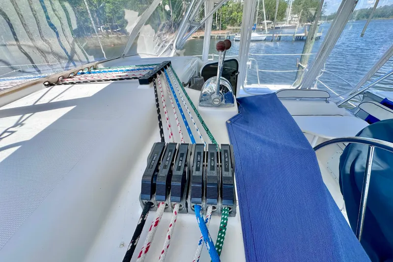 Slide: The Image of Cockpit of 1998 Manta 40 sailboat with control lines and throttle lever. - 94