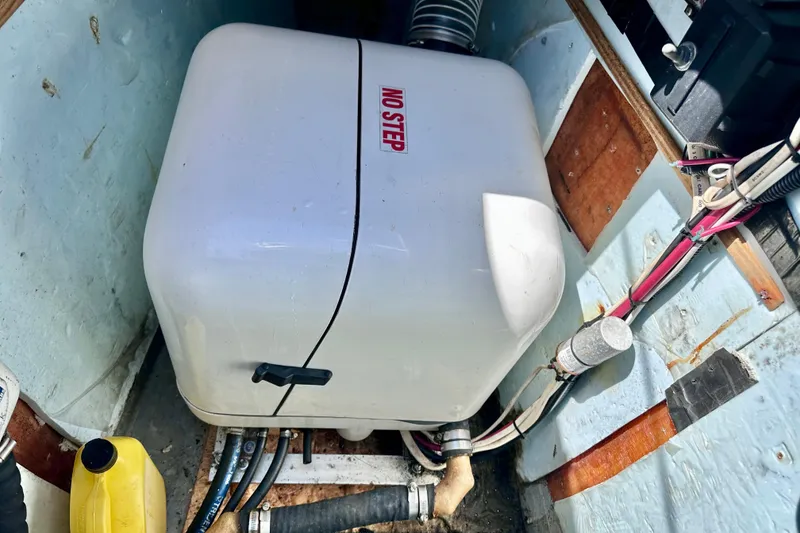Slide: The Image of Engine compartment of a 1998 Manta 40 boat with "No Step" warning. - 97