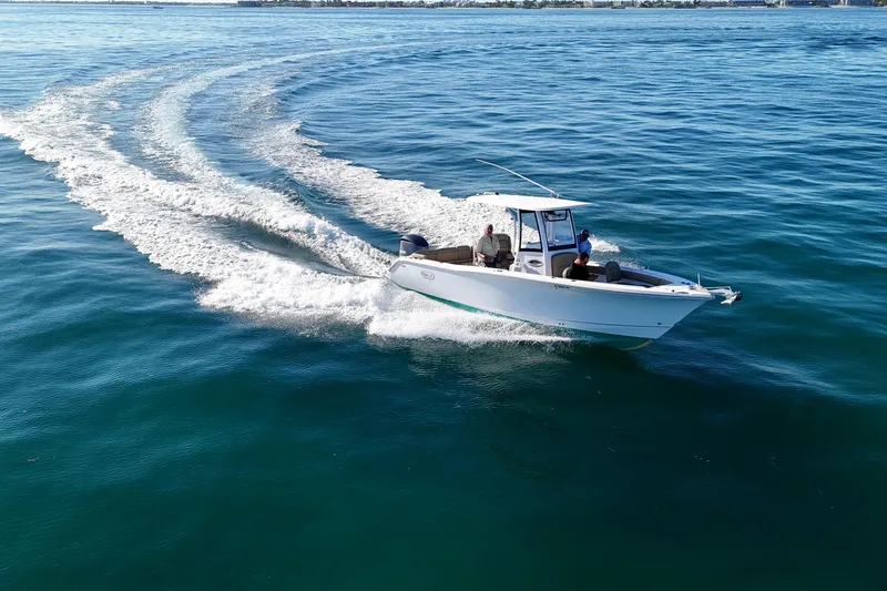 The Image of 2018 Sea Hunt Ultra 255 SE boat cruising on open water. - 0
