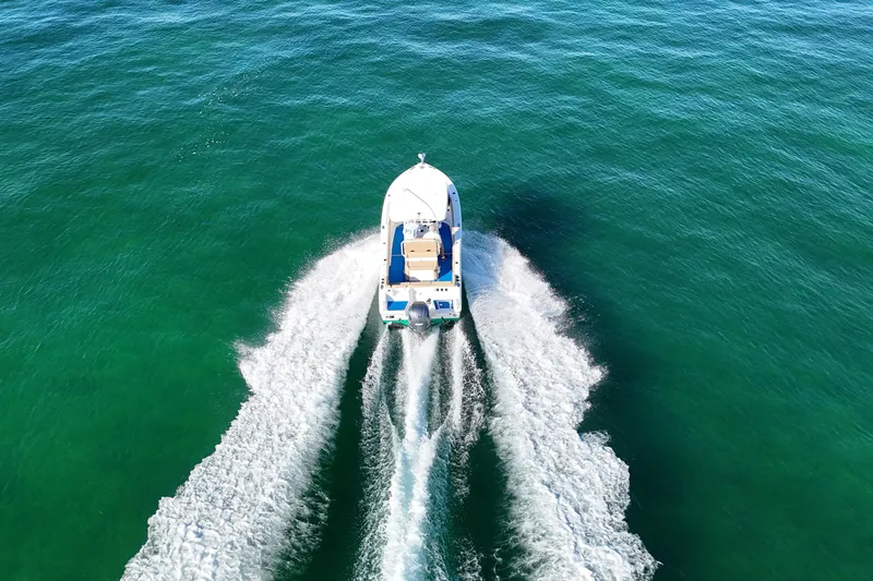 Slide: The Image of Aerial view of 2018 Sea Hunt Ultra 255 SE boat cruising on open water. - 3