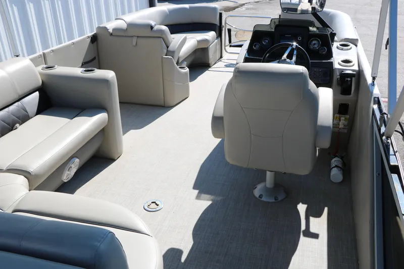 Slide: The Image of 2020 Silver Wave 2210 SW5 L pontoon boat interior with beige seating and steering console. - 31