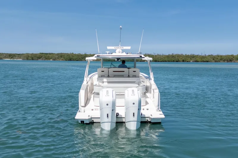 Slide: The Image of 2024 Tiara Yachts 43 LS cruising on calm blue waters. - 8