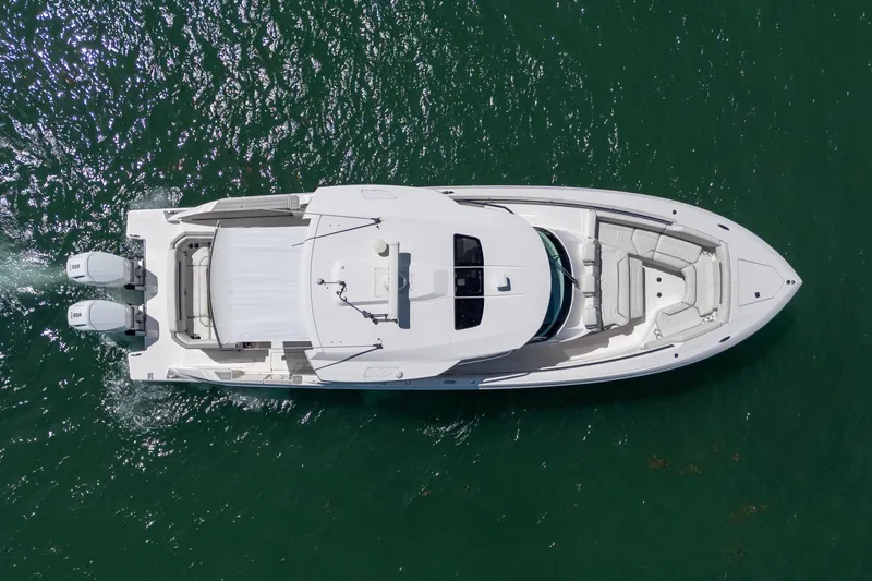 Slide: The Image of Overhead view of 2024 Tiara Yachts 43 LS cruising on water. - 9