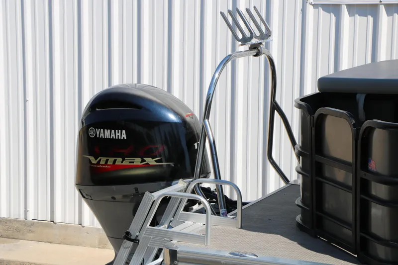 Slide: The Image of 2019 Berkshire 22CL CTS pontoon boat with Yamaha VMAX outboard motor, docked near a metal building. - 11