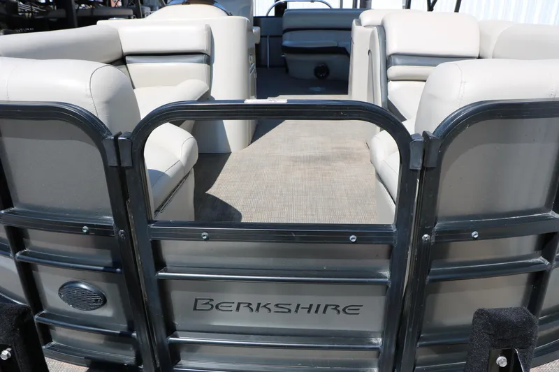 Slide: The Image of 2019 Berkshire 22CL CTS pontoon boat interior with beige seating and open deck. - 19