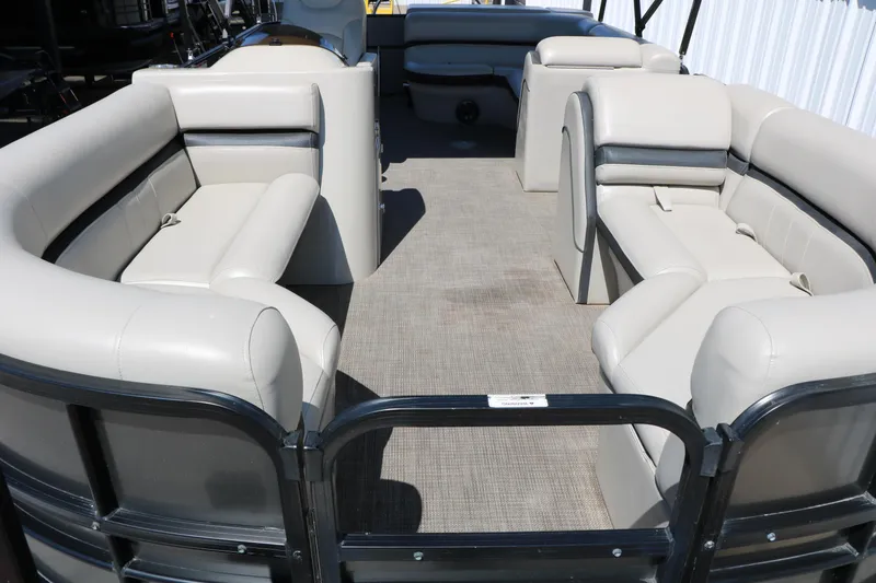 Slide: The Image of 2019 Berkshire 22CL CTS pontoon boat interior with beige seating and spacious layout. - 20