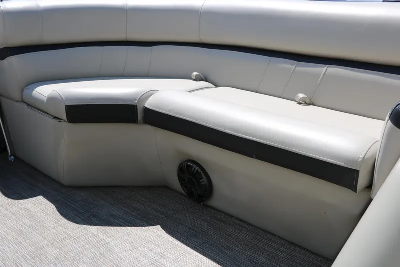 Slide: The Image of Interior seating of a 2019 Berkshire 22CL CTS pontoon boat, featuring beige upholstery. - 32