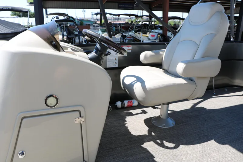 Slide: The Image of Captain's chair and helm of 2019 Berkshire 22CL CTS pontoon boat. - 33
