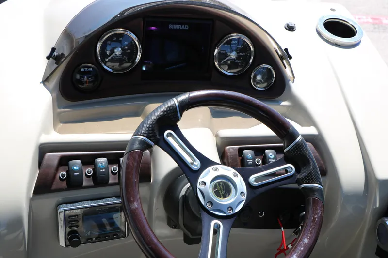 Slide: The Image of Steering console of 2019 Berkshire 22CL CTS boat with gauges and controls. - 36
