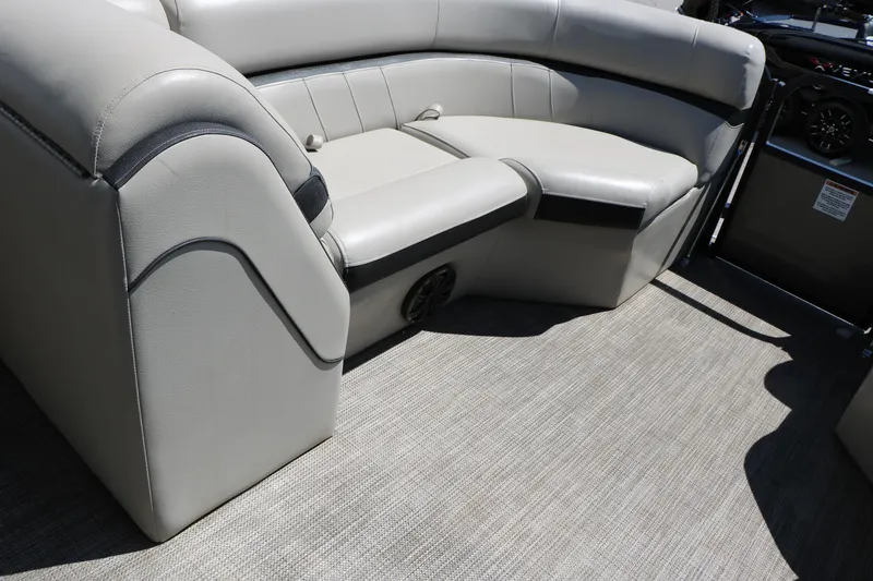 Slide: The Image of 2019 Berkshire 22CL CTS boat interior with gray seating and carpet flooring. - 38