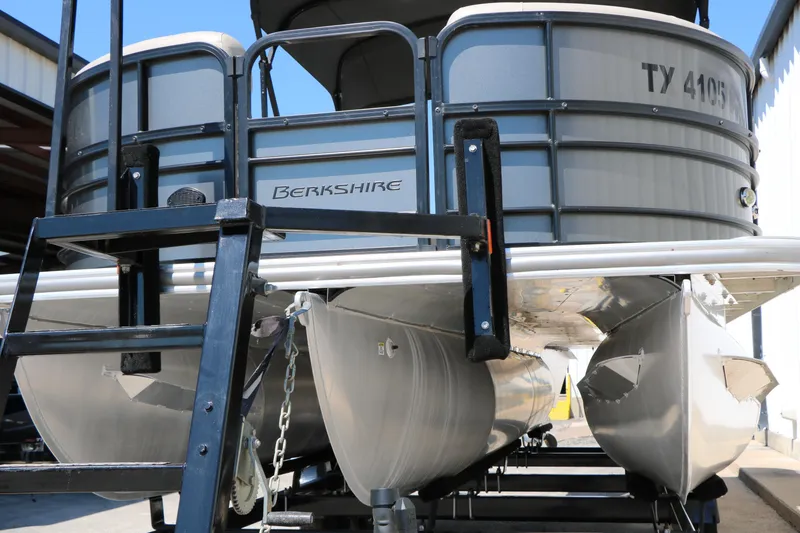 Slide: The Image of 2019 Berkshire 22CL CTS pontoon boat on trailer, rear view with ladder and pontoons visible. - 5