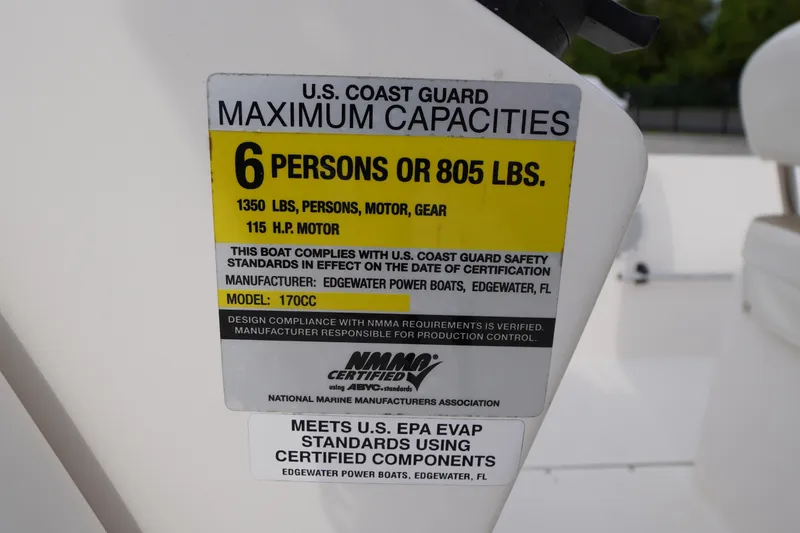 Slide: The Image of U.S. Coast Guard capacity label on 2015 Edgewater 170CC boat, 6 persons or 805 lbs. - 11