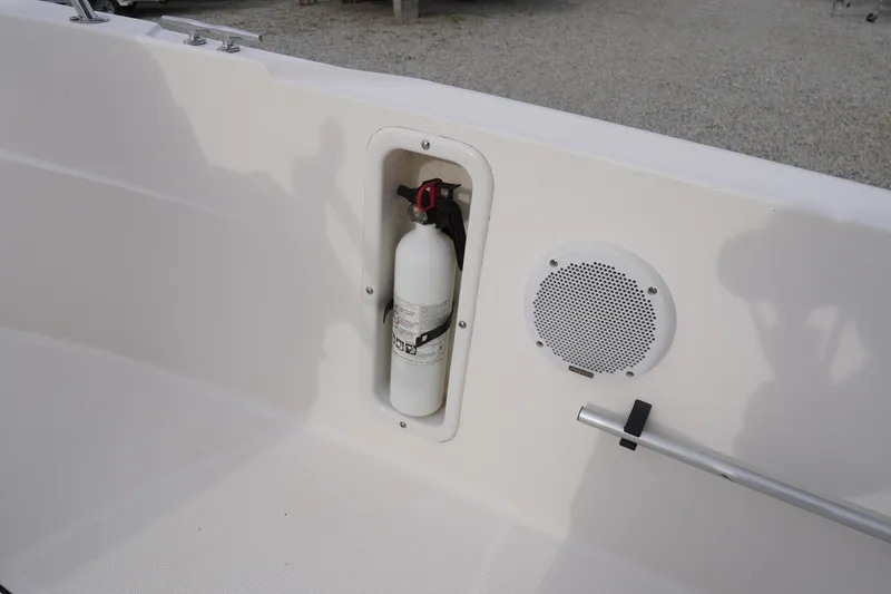 Slide: The Image of 2015 Edgewater 170CC boat interior with fire extinguisher and speaker. - 12