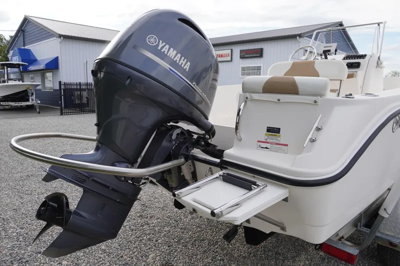 Slide: The Image of 2015 Edgewater 170CC boat with Yamaha outboard motor, displayed outdoors. - 17