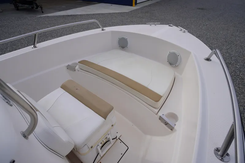 Slide: The Image of 2015 Edgewater 170CC boat interior with cushioned seating and stainless steel railings. - 4