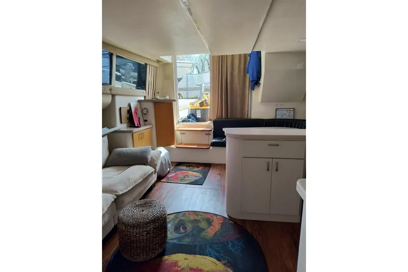 Slide: The Image of Interior of 1996 Mainship 40 Sedan Bridge with cozy seating and modern decor. - 12