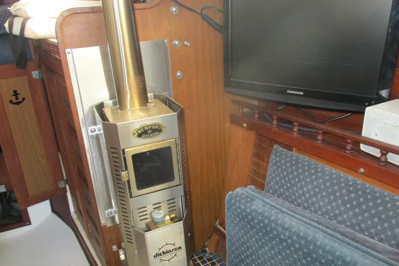 Slide: The Image of 1978 Catalina 30 interior with Dickinson Newport heater and Memorex TV setup. - 12