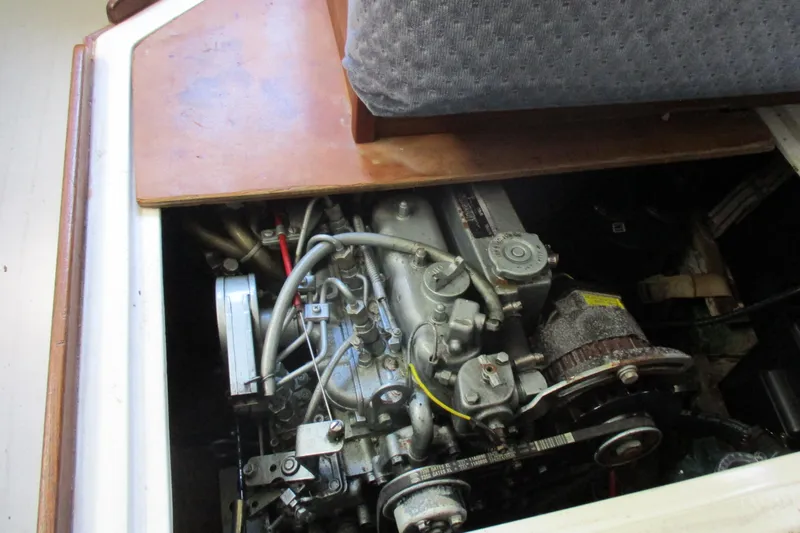Slide: The Image of Engine compartment of a 1978 Catalina 30 sailboat, showcasing mechanical components. - 15