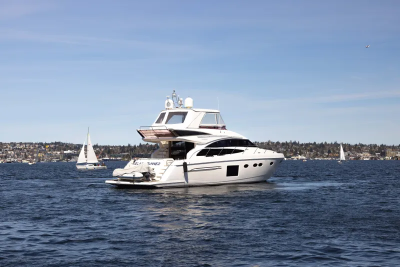 Slide: The Image of 2014 Princess 64 Flybridge Motor Yacht on open water. - 10