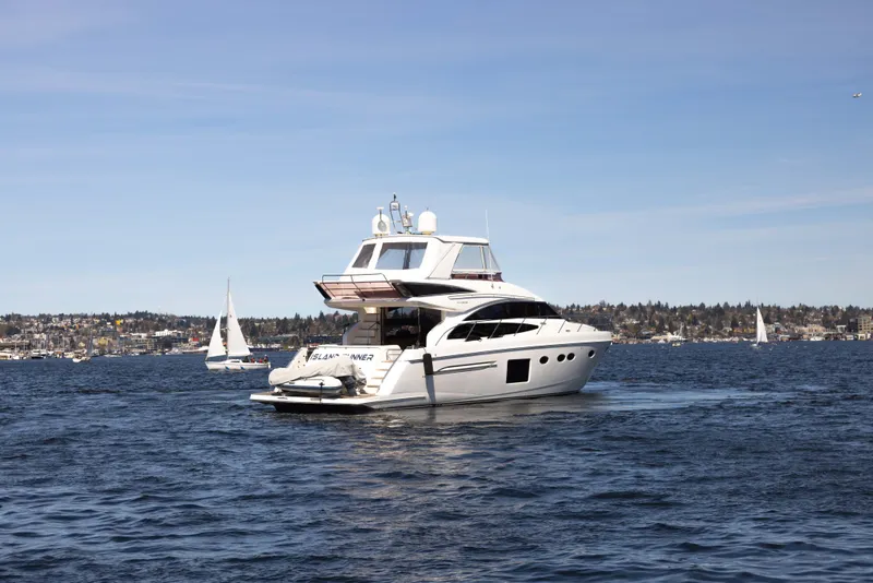 Slide: The Image of 2014 Princess 64 Flybridge Yacht on open water. - 11