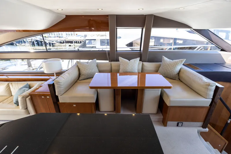 Slide: The Image of Interior of Princess 64 Flybridge Yacht, luxurious seating area with table. - 17