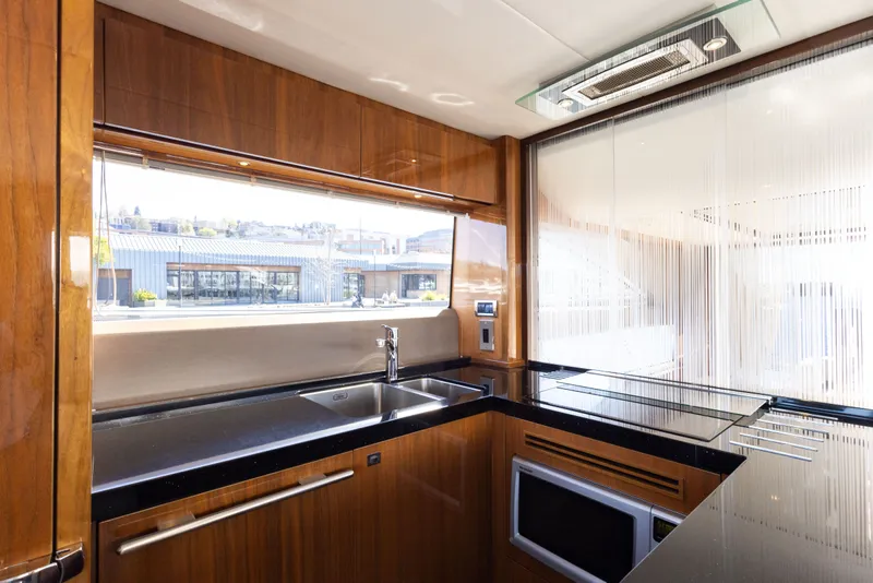 Slide: The Image of Princess 64 Flybridge Yacht kitchen, 2014 model, featuring modern appliances. - 19