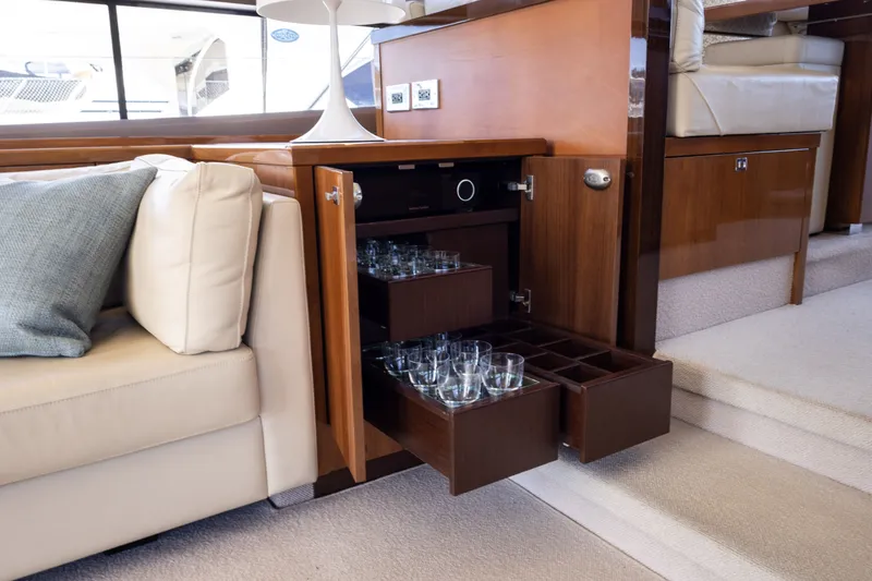Slide: The Image of Luxurious interior of Princess 64 Flybridge Yacht with glassware. - 24