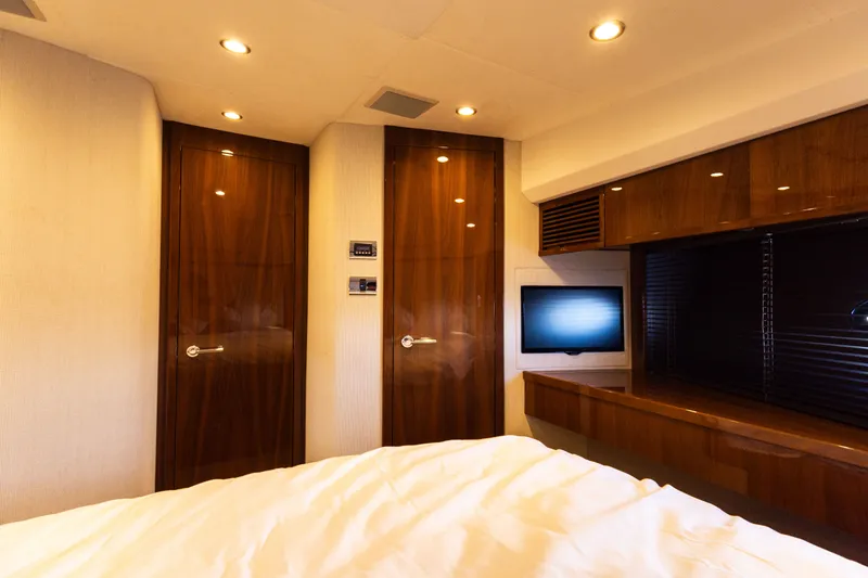 Slide: The Image of Luxurious bedroom on a 2014 Princess 64 Flybridge yacht. - 29
