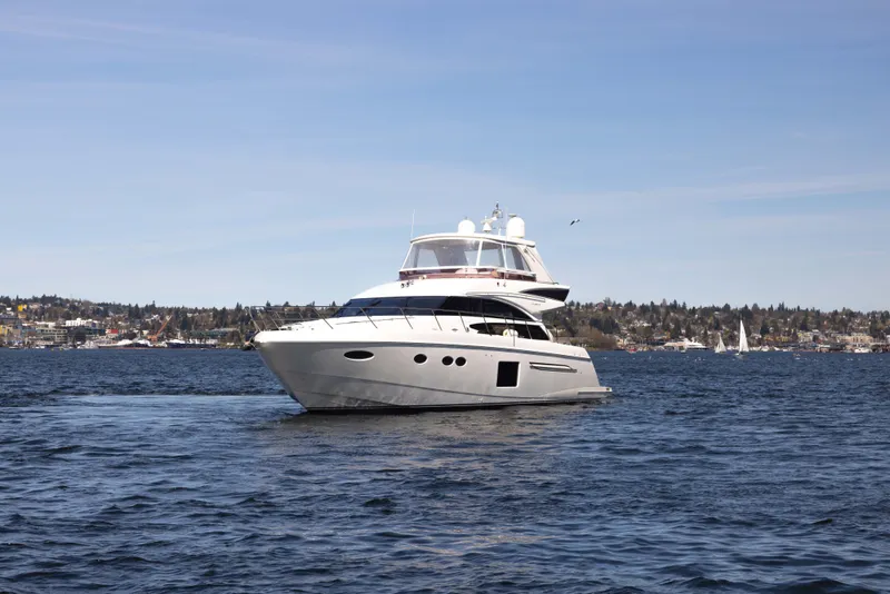 Slide: The Image of 2014 Princess 64 Flybridge Motor Yacht on open water. - 4