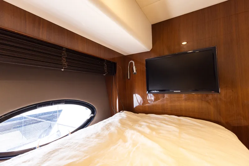 Slide: The Image of Interior of Princess 64 Flybridge Yacht with TV and window. - 46