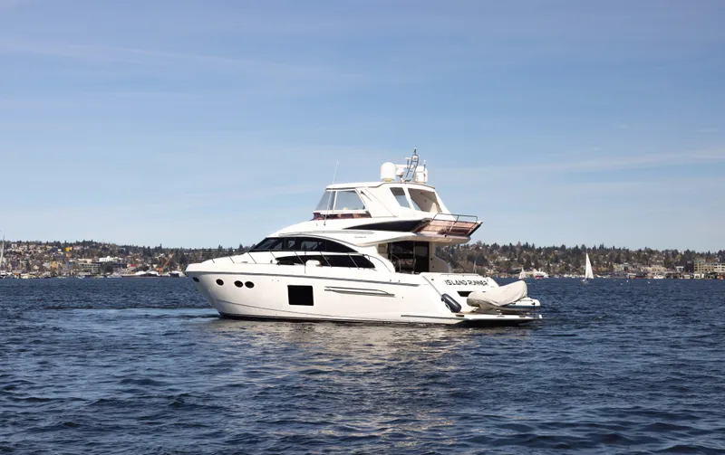 Slide: The Image of 2014 Princess 64 Flybridge Motor Yacht on calm waters. - 6