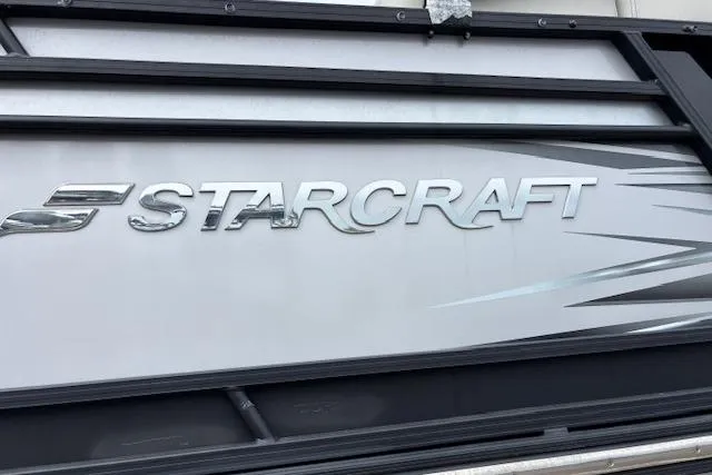 Slide: The Image of Cockpit view of a 2021 Starcraft SLS 3 boat with navigation display and controls. - 14