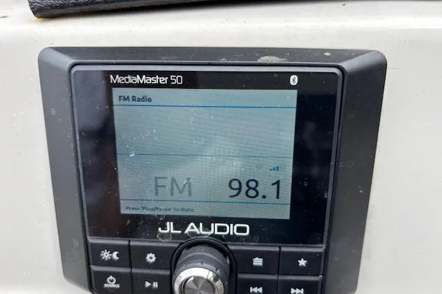 Slide: The Image of JL Audio MediaMaster 50 displaying FM radio at 98.1 frequency on a 2021 Starcraft SLS 3. - 18