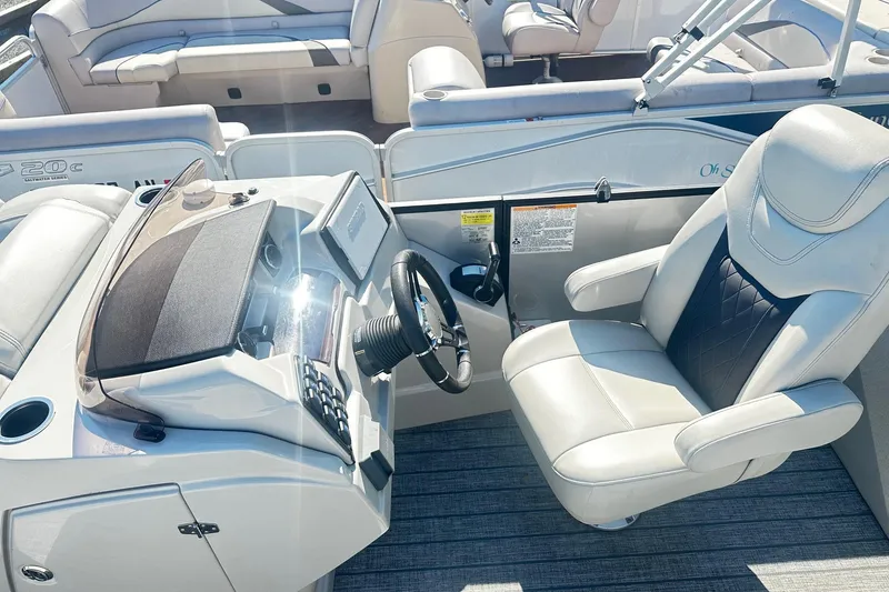 Slide: The Image of Simrad display on 2021 Starcraft SLS 3 boat dashboard, reflecting outdoor scene. - 19