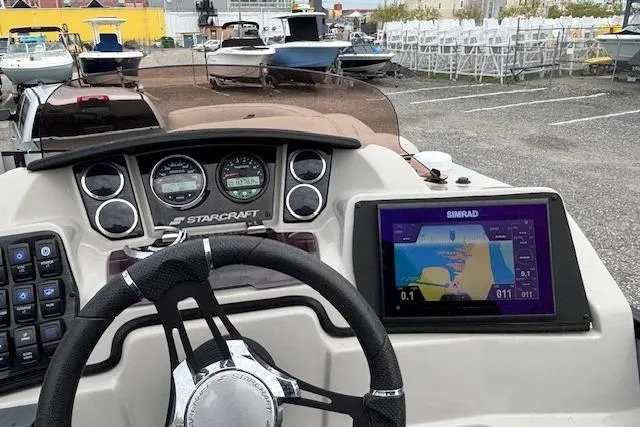 Slide: The Image of Luxurious captain's chair on 2021 Starcraft SLS 3 boat, featuring plush upholstery and armrests. - 20