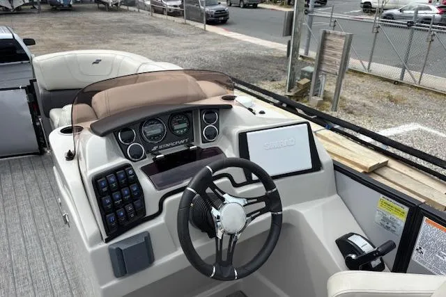 Slide: The Image of Simrad navigation display on a 2021 Starcraft SLS 3 boat, showing map and speed data. - 22
