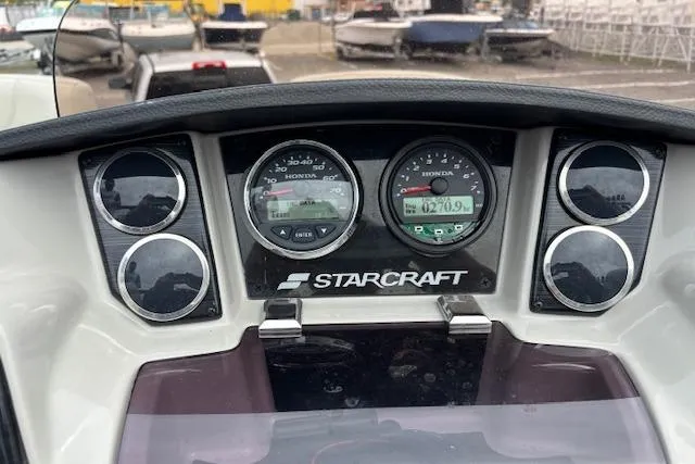 Slide: The Image of 2021 Starcraft SLS 3 pontoon boat with spacious seating and central table. - 23