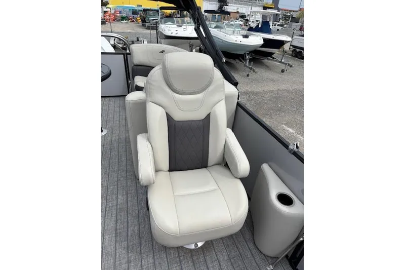 Slide: The Image of Luxurious seating on a 2021 Starcraft SLS 3 boat, featuring elegant upholstery and cup holders. - 28