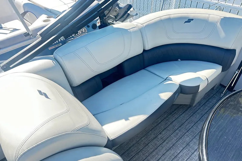 Slide: The Image of Storage compartment in 2021 Starcraft SLS 3 boat with yellow life jackets. - 35
