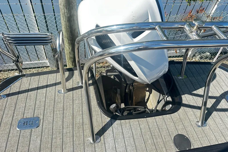 Slide: The Image of 2021 Starcraft SLS 3 boat engine compartment with stainless steel railing and deck. - 39