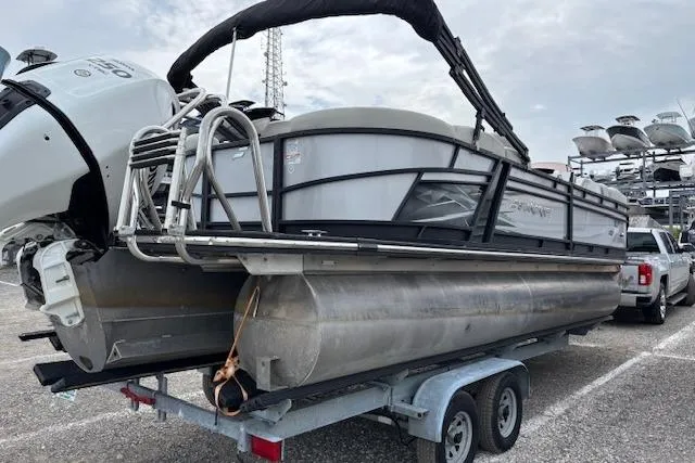 Slide: The Image of Manufacturer Provided Image: 2021 Starcraft SLS 3 pontoon boat cruising on water with passengers. - 5