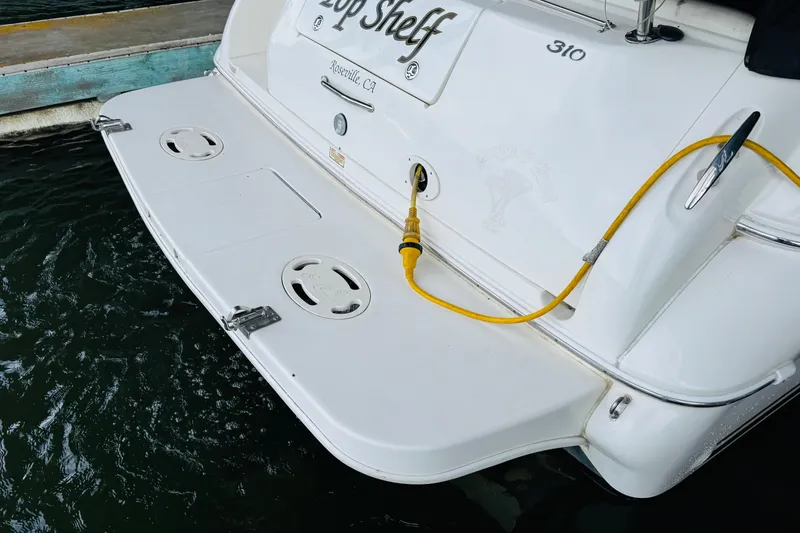 Slide: The Image of 2001 Sea Ray Sundancer 310 boat stern with power cable, docked in Roseville, CA. - 16