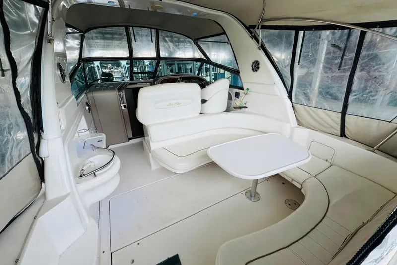 Slide: The Image of Interior of a 2001 Sea Ray Sundancer 310 boat with seating and table. - 17