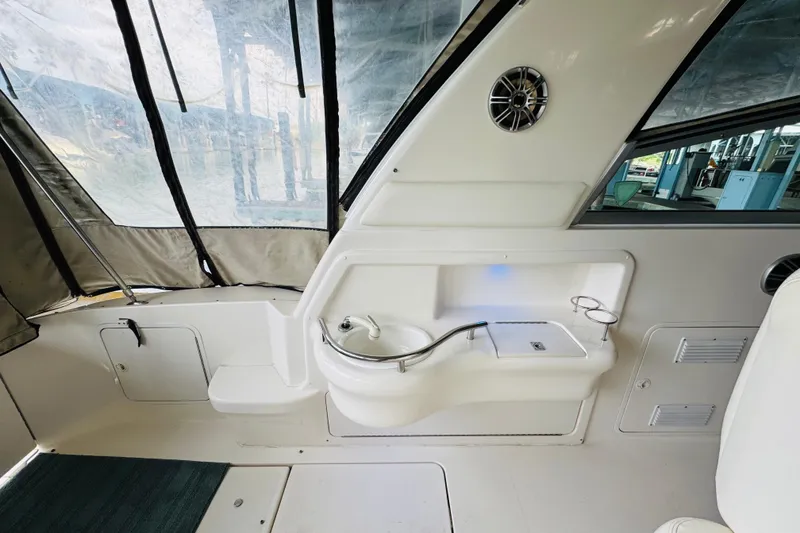 Slide: The Image of Interior view of 2001 Sea Ray Sundancer 310 boat with sink and seating area. - 21