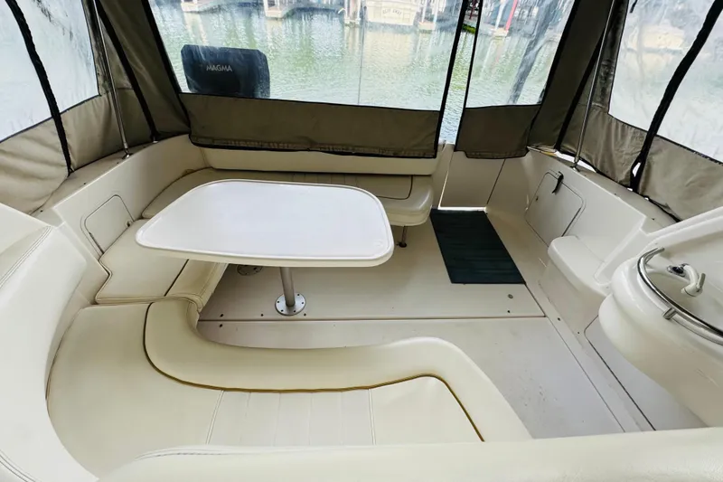Slide: The Image of Interior view of 2001 Sea Ray Sundancer 310 boat with seating and table. - 23