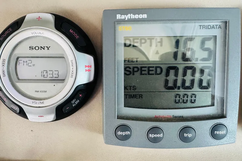 Slide: The Image of Sony marine stereo and Raytheon depth gauge on 2001 Sea Ray Sundancer 310 boat. - 29