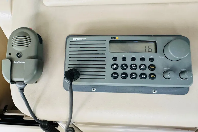 Slide: The Image of Raytheon marine radio system on 2001 Sea Ray Sundancer 310 boat dashboard. - 30