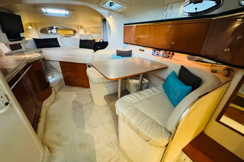 Slide: The Image of Interior of 2001 Sea Ray Sundancer 310 yacht with cozy seating and modern amenities. - 31